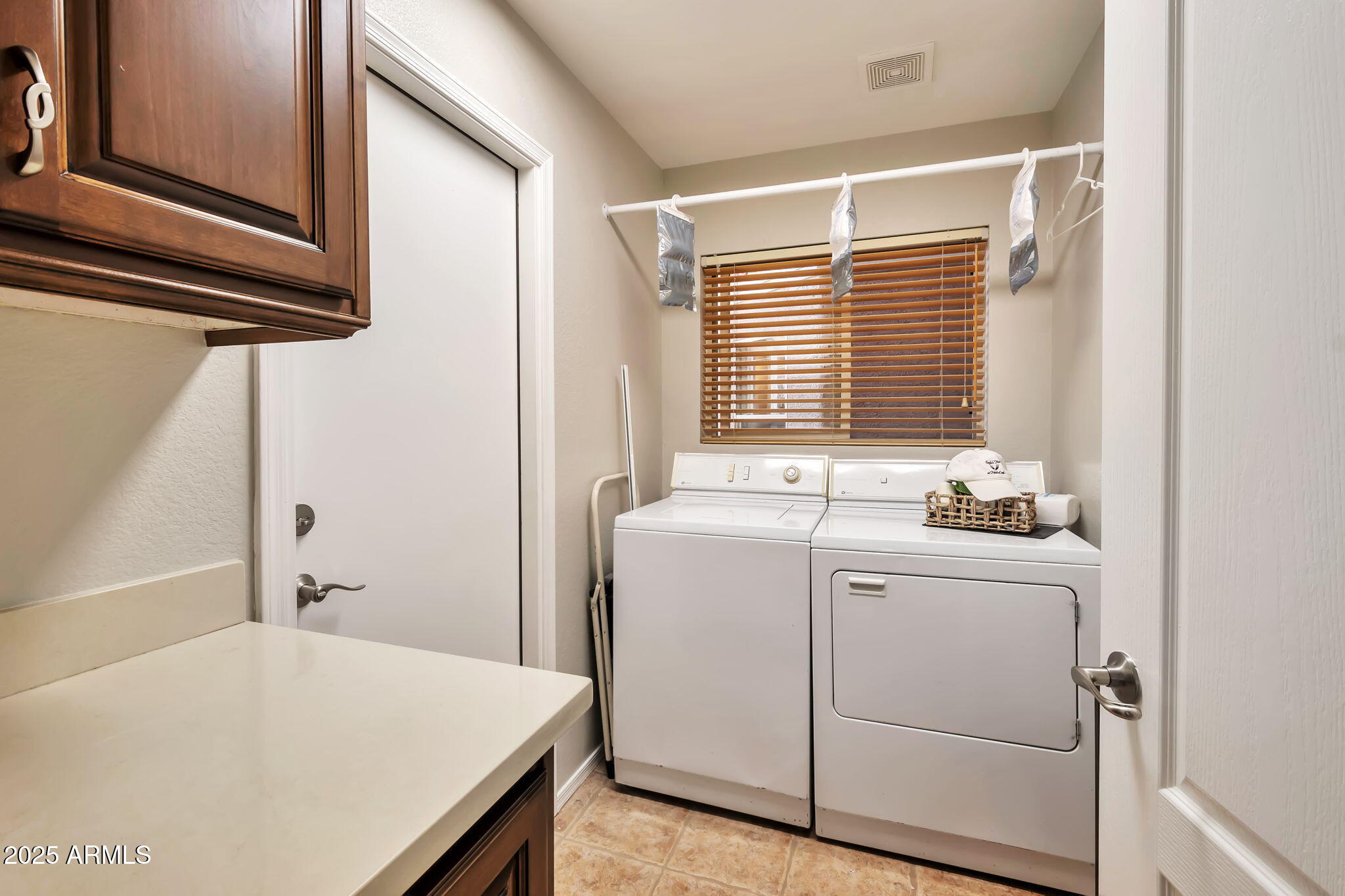 15460 West Merrell Street Goodyear, AZ 85395 - Photo 24 of 30 a utility room with dryer and washer