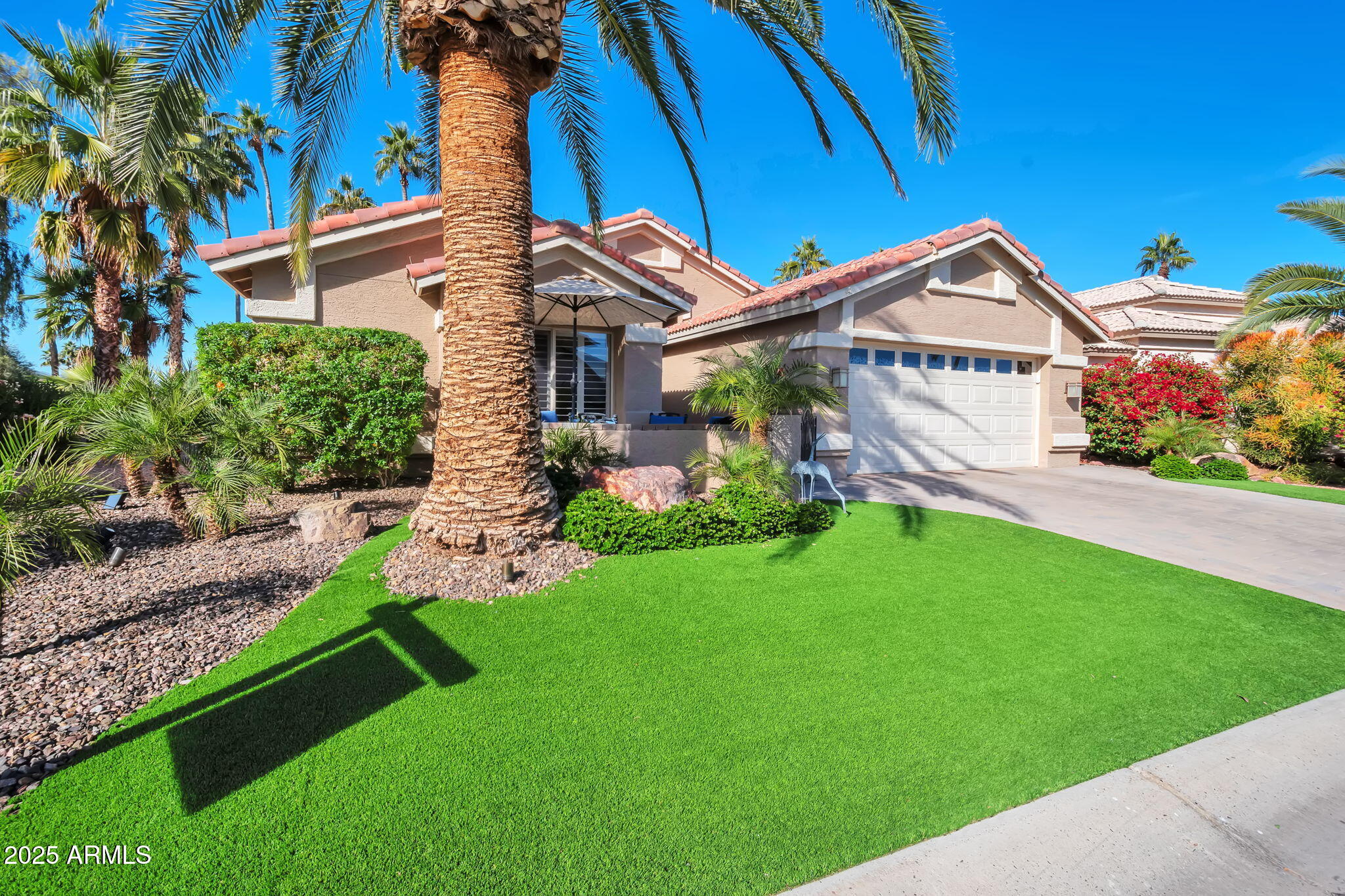 15460 West Merrell Street Goodyear, AZ 85395 - Photo 25 of 30 a front view of a house with a yard