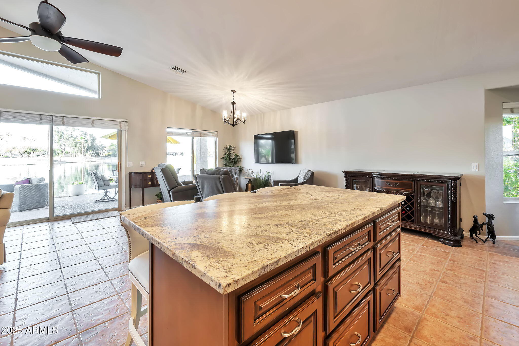 15460 West Merrell Street Goodyear, AZ 85395 - Photo 10 of 30 a room with a sink dishwasher and a fireplace with wooden floor