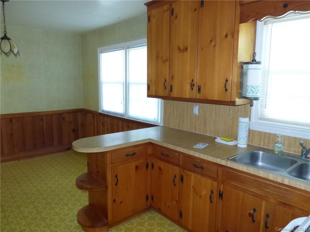5229 Manning Road Charlotte, NC 28269 - Photo 12 of 18 a kitchen with a sink and a window