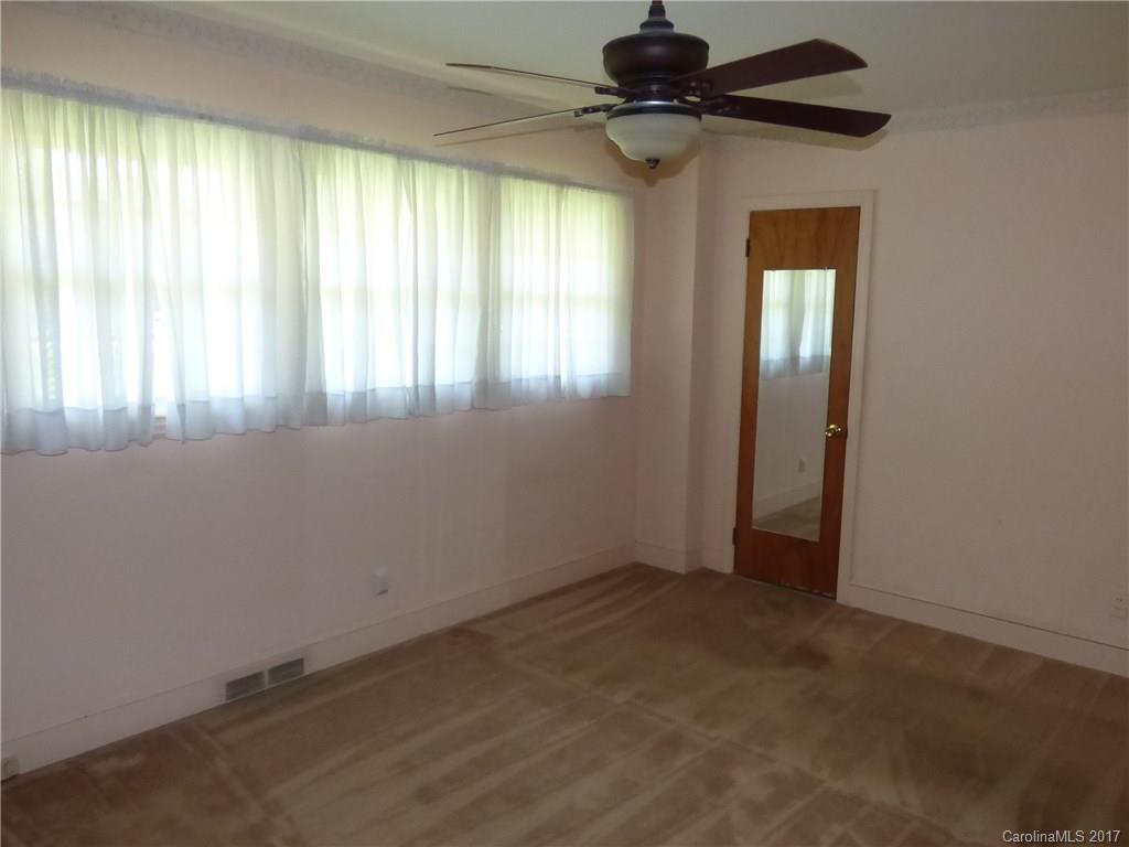 5229 Manning Road Charlotte, NC 28269 - Photo 13 of 18 an empty room with windows and fan
