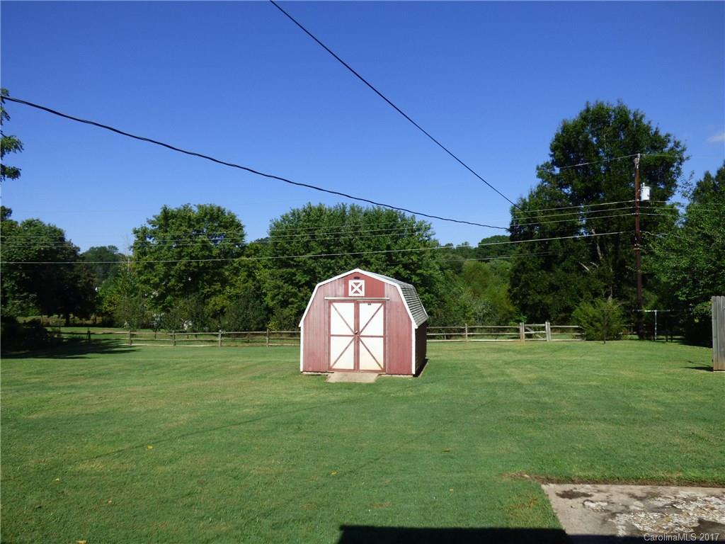 5229 Manning Road Charlotte, NC 28269 - Photo 16 of 18 a view of a garden with a swimming pool