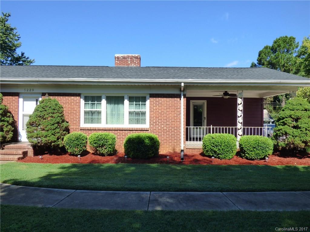 5229 Manning Road Charlotte, NC 28269 - Photo 3 of 18 a front view of a house with a yard