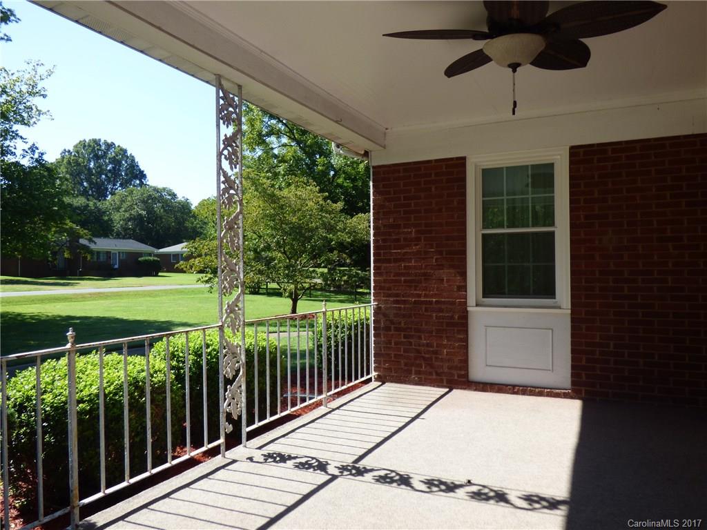 5229 Manning Road Charlotte, NC 28269 - Photo 5 of 18 a view of a balcony with a floor to ceiling window and wooden fence