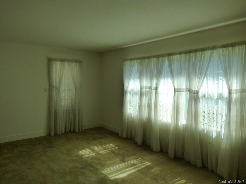 5229 Manning Road Charlotte, NC 28269 - Photo 8 of 18 a view of an empty room and window