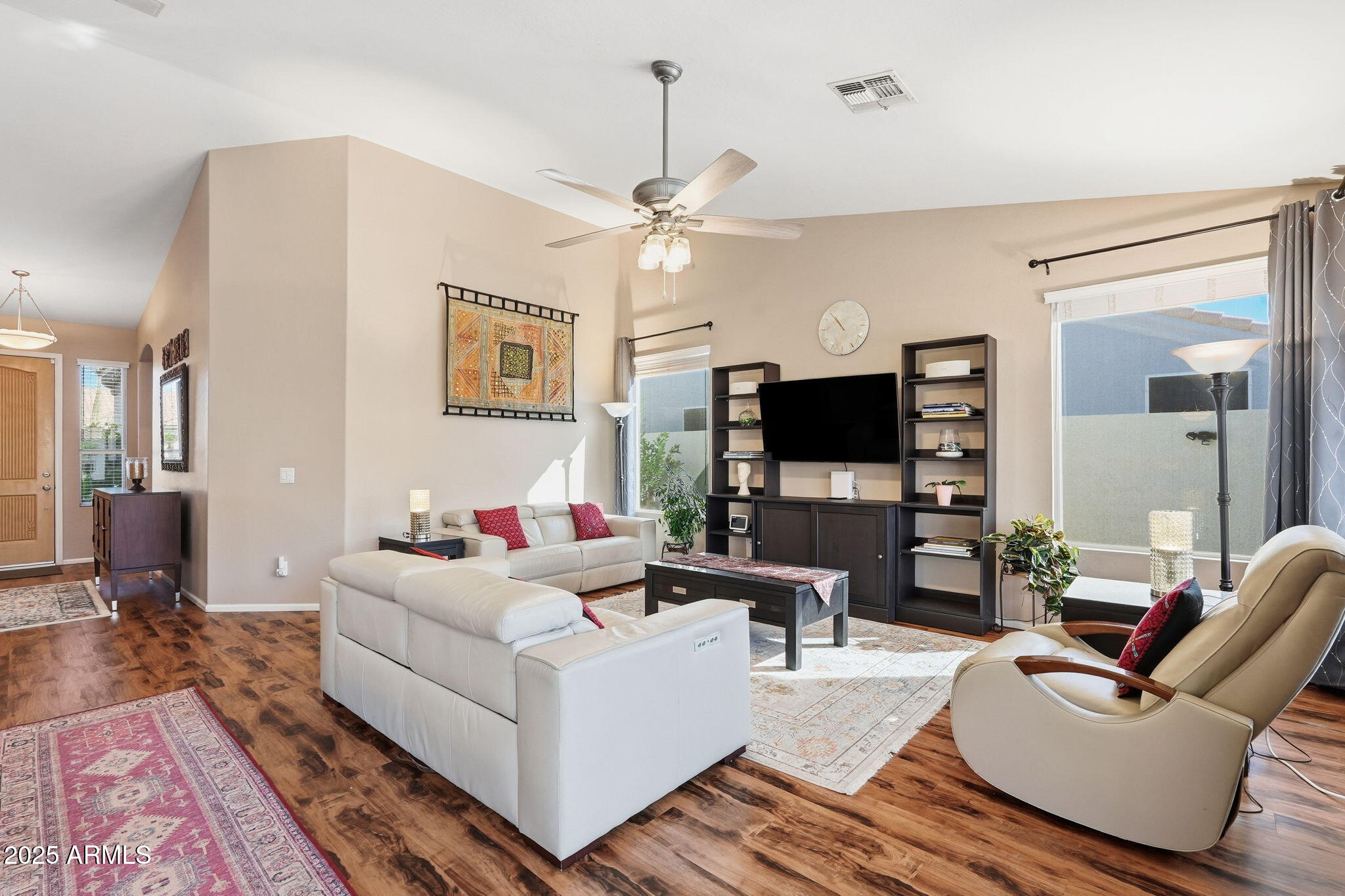 7137 East Laguna Azul Avenue Mesa, AZ 85209 - Photo 11 of 58 a living room with furniture and a flat screen tv