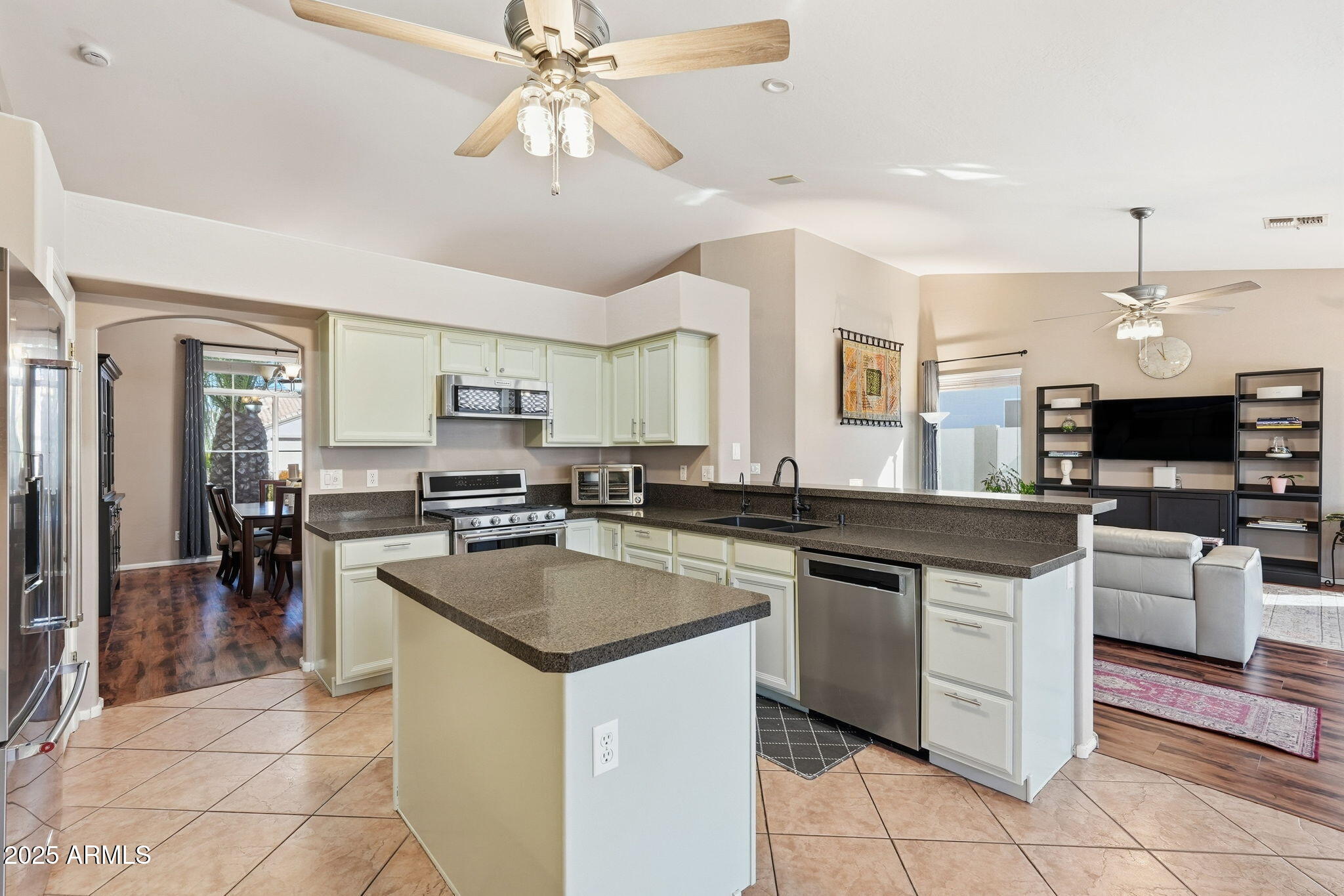 7137 East Laguna Azul Avenue Mesa, AZ 85209 - Photo 13 of 58 a kitchen with cabinets a sink and appliances