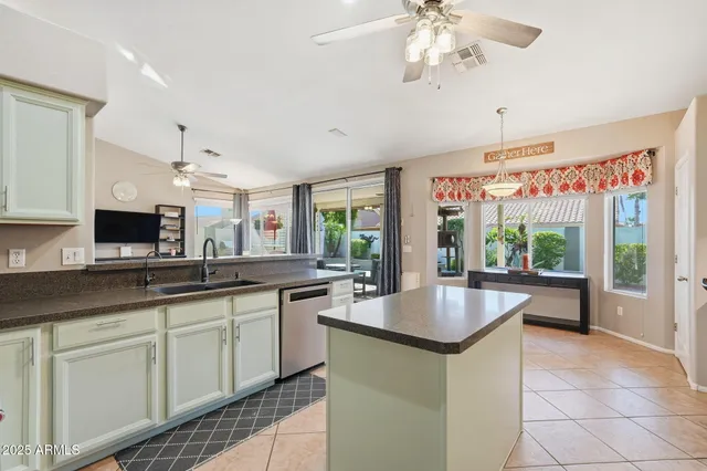 a kitchen with stainless steel appliances granite countertop a sink and cabinets