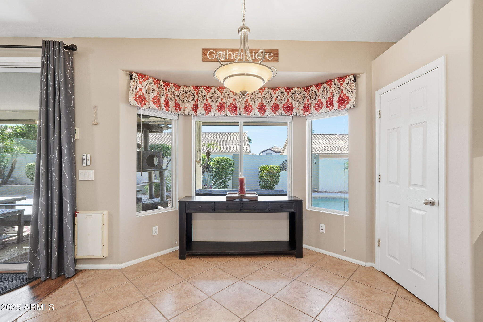 7137 East Laguna Azul Avenue Mesa, AZ 85209 - Photo 19 of 58 a living room with furniture and a large window
