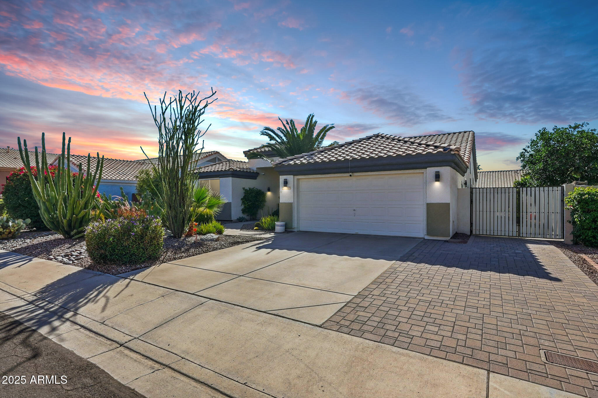 7137 East Laguna Azul Avenue Mesa, AZ 85209 - Photo 2 of 58 a front view of a house with a yard and garage