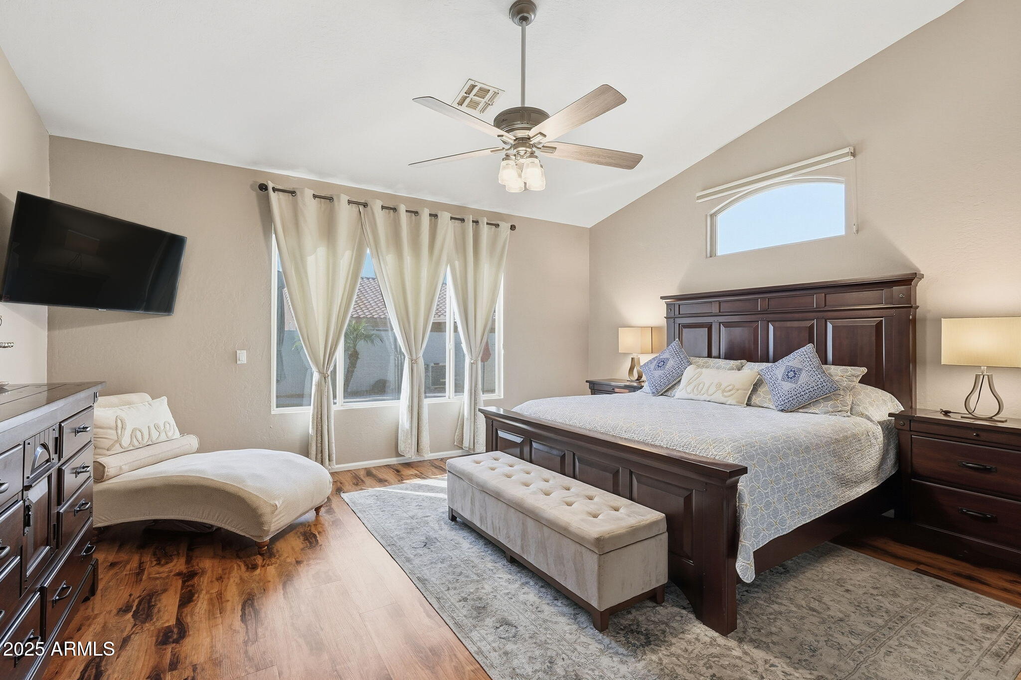 7137 East Laguna Azul Avenue Mesa, AZ 85209 - Photo 25 of 58 a bedroom with a bed and a flat screen tv
