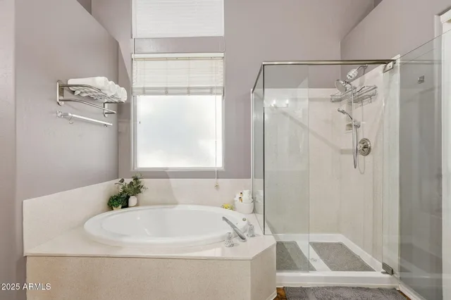 a bathroom with a sink double vanity and a mirror