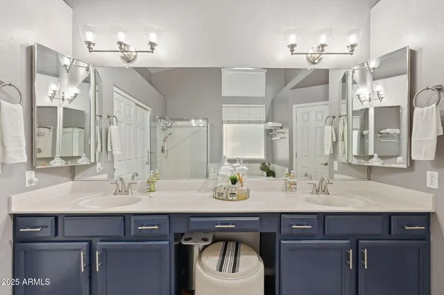 a spacious bathroom with a tub sink a toilet and mirror