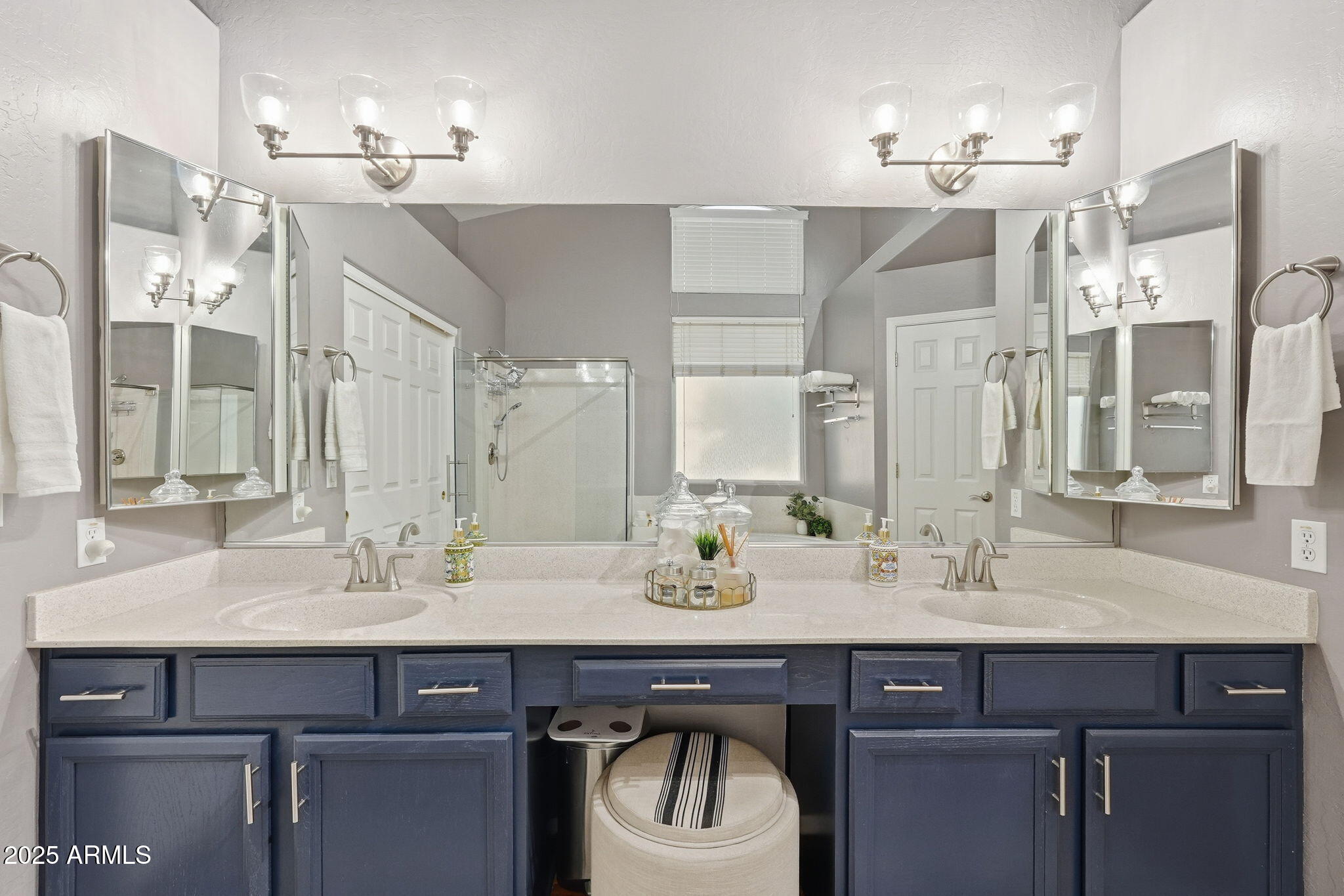 7137 East Laguna Azul Avenue Mesa, AZ 85209 - Photo 29 of 58 a bathroom with a sink and a mirror