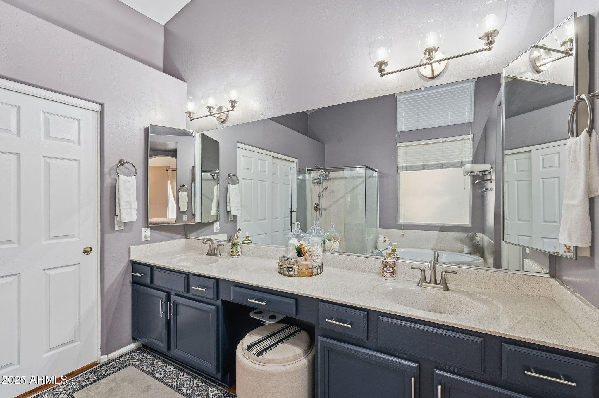 7137 East Laguna Azul Avenue Mesa, AZ 85209 - Photo 30 of 58 a bathroom with a sink double vanity and a mirror