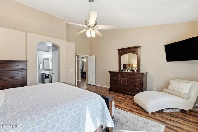 a bedroom with a bed and a chair