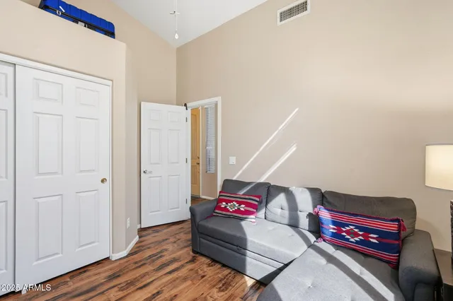 a bedroom with a bed and a lamp