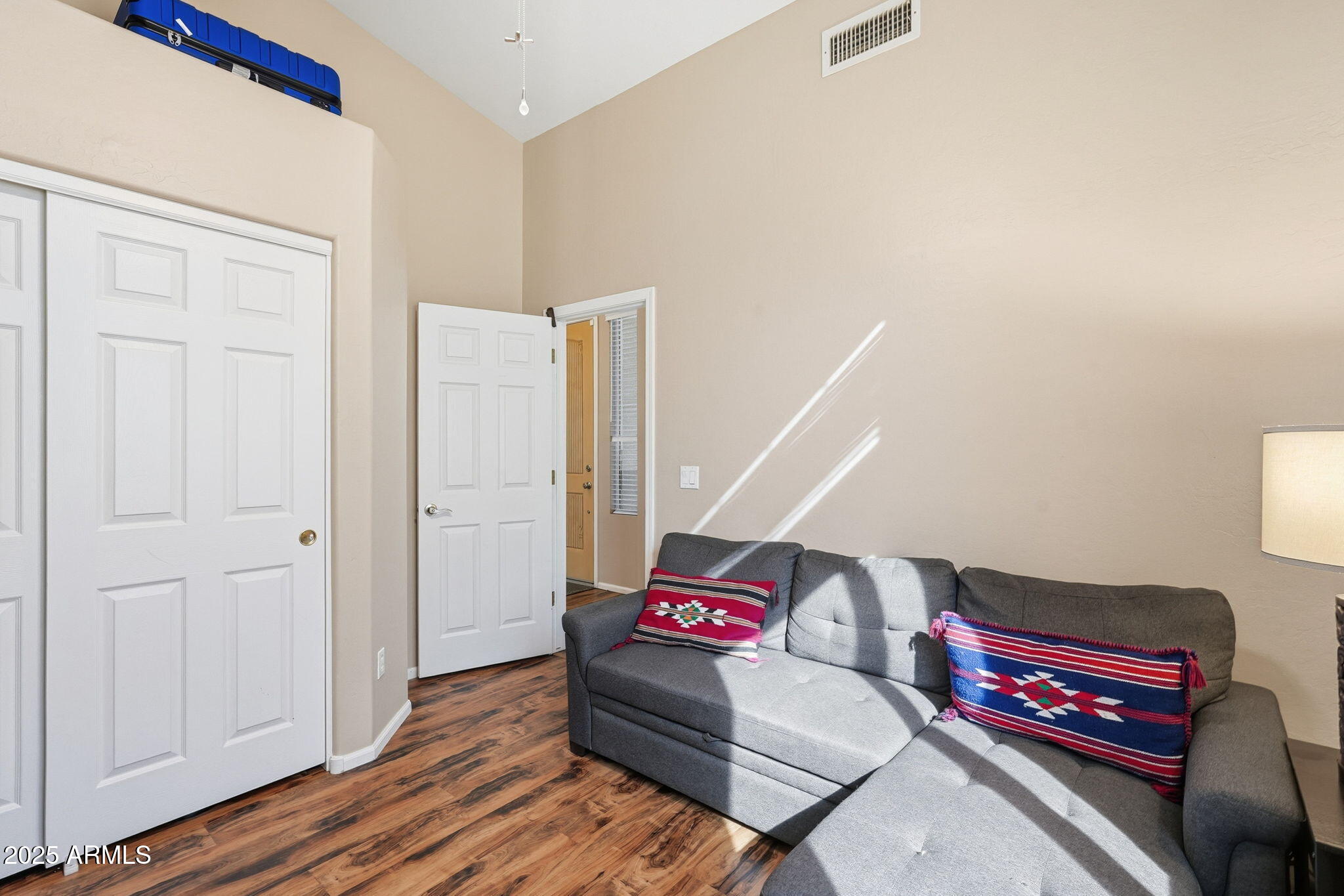 7137 East Laguna Azul Avenue Mesa, AZ 85209 - Photo 35 of 58 a living room with furniture and wooden floor