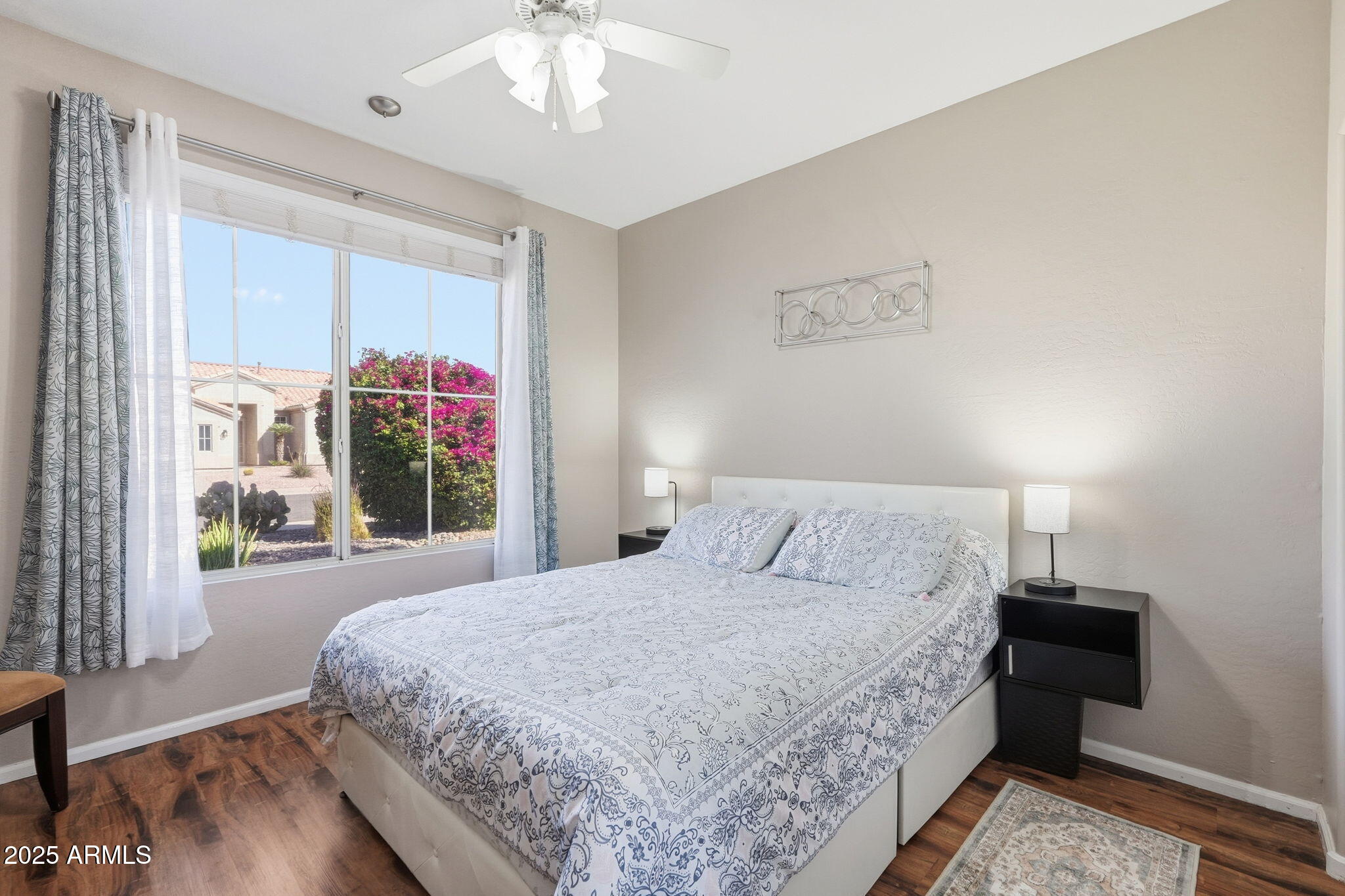 7137 East Laguna Azul Avenue Mesa, AZ 85209 - Photo 36 of 58 a bedroom with a bed and a large window