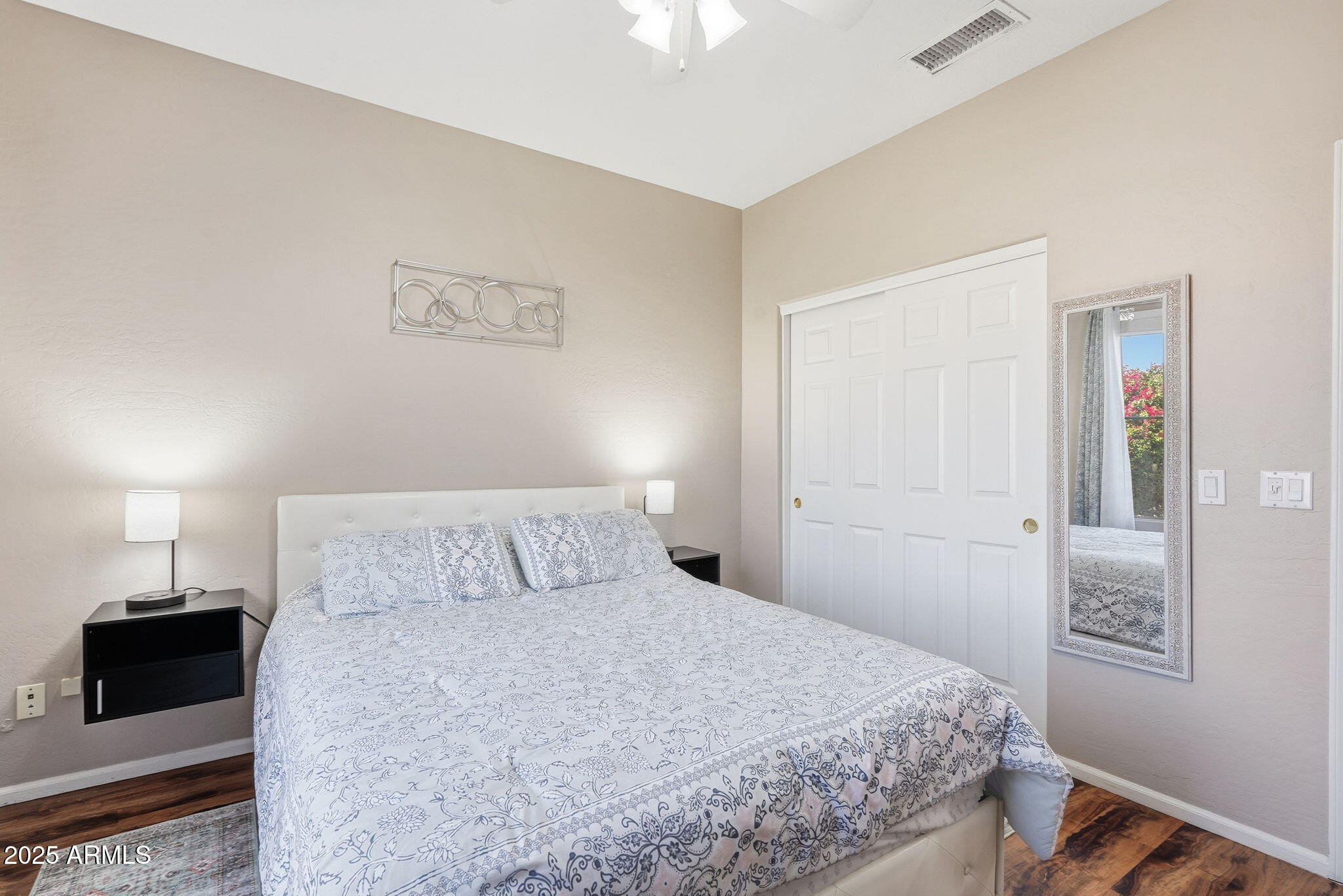 7137 East Laguna Azul Avenue Mesa, AZ 85209 - Photo 37 of 58 a bedroom with a bed and a lamp