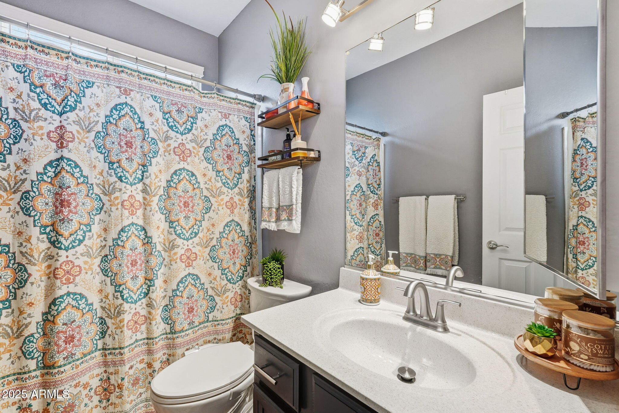 7137 East Laguna Azul Avenue Mesa, AZ 85209 - Photo 38 of 58 a bathroom with a sink toilet and shower
