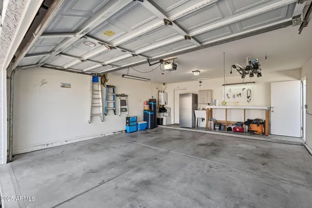 a view of a backyard with plants and a patio