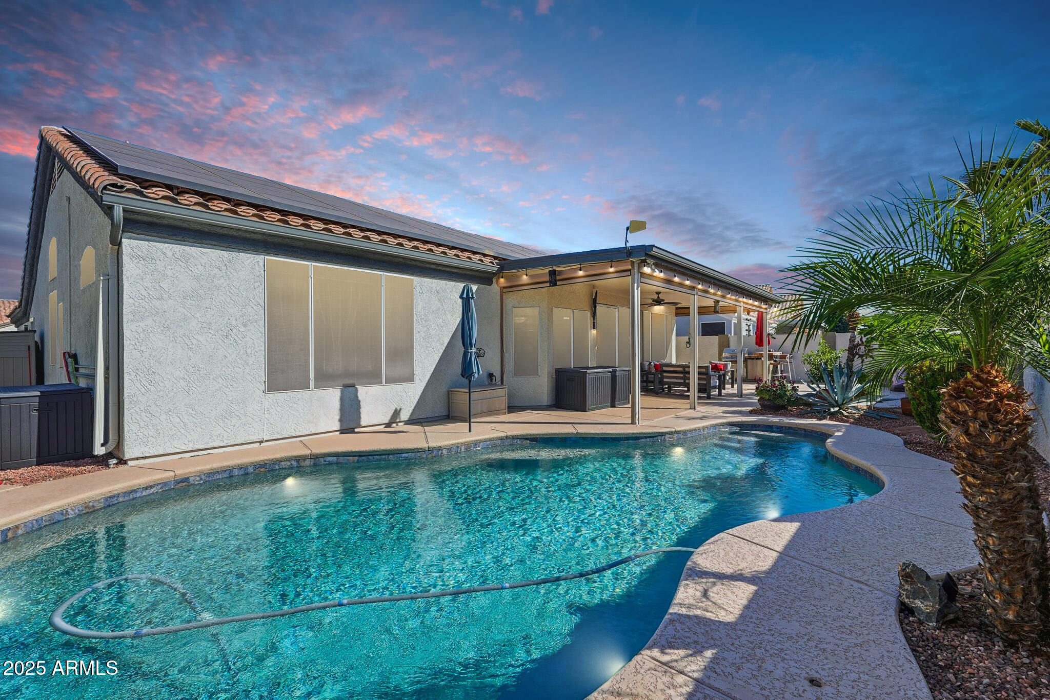 7137 East Laguna Azul Avenue Mesa, AZ 85209 - Photo 49 of 58 a view of house with garden space and swimming pool