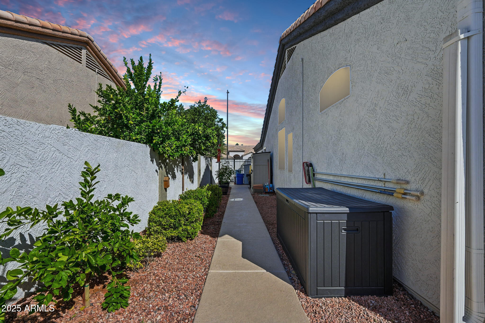 7137 East Laguna Azul Avenue Mesa, AZ 85209 - Photo 51 of 58 a pathway of a house with a yard