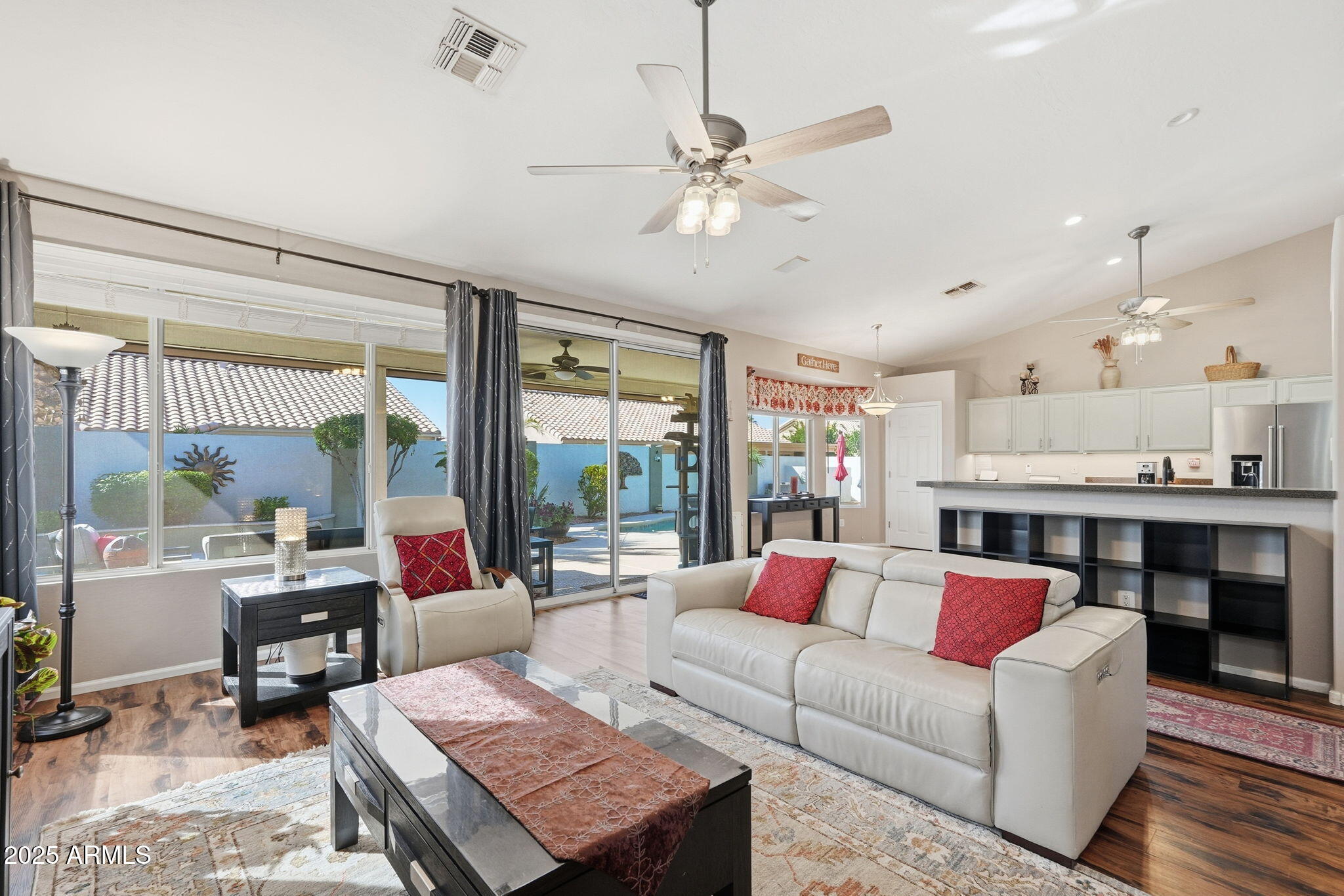 7137 East Laguna Azul Avenue Mesa, AZ 85209 - Photo 9 of 58 a living room with furniture and a large window