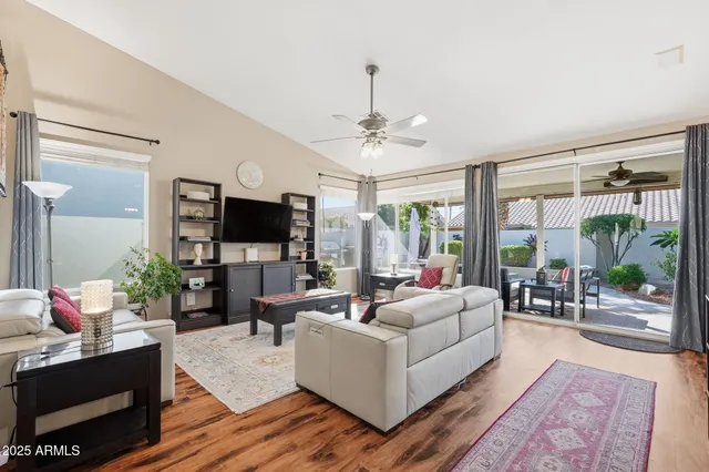 a living room with furniture and a rug