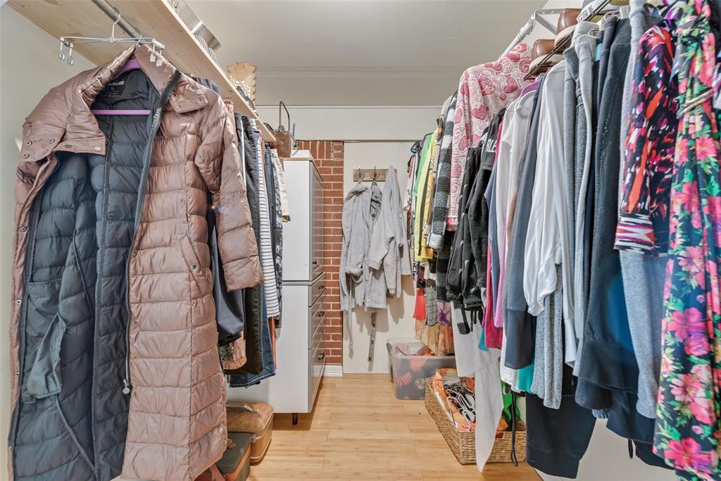 10605 Ferguson Road Dallas, TX 75228 - Photo 12 of 27 a view of walk in closet with clothes and shoes