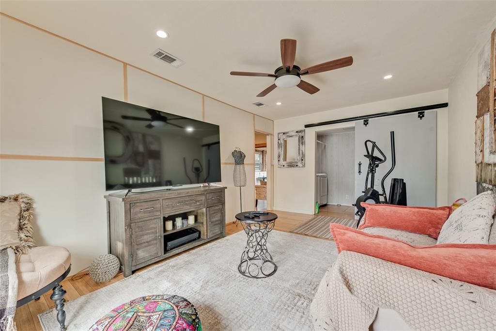 10605 Ferguson Road Dallas, TX 75228 - Photo 17 of 27 a living room with furniture and a flat screen tv