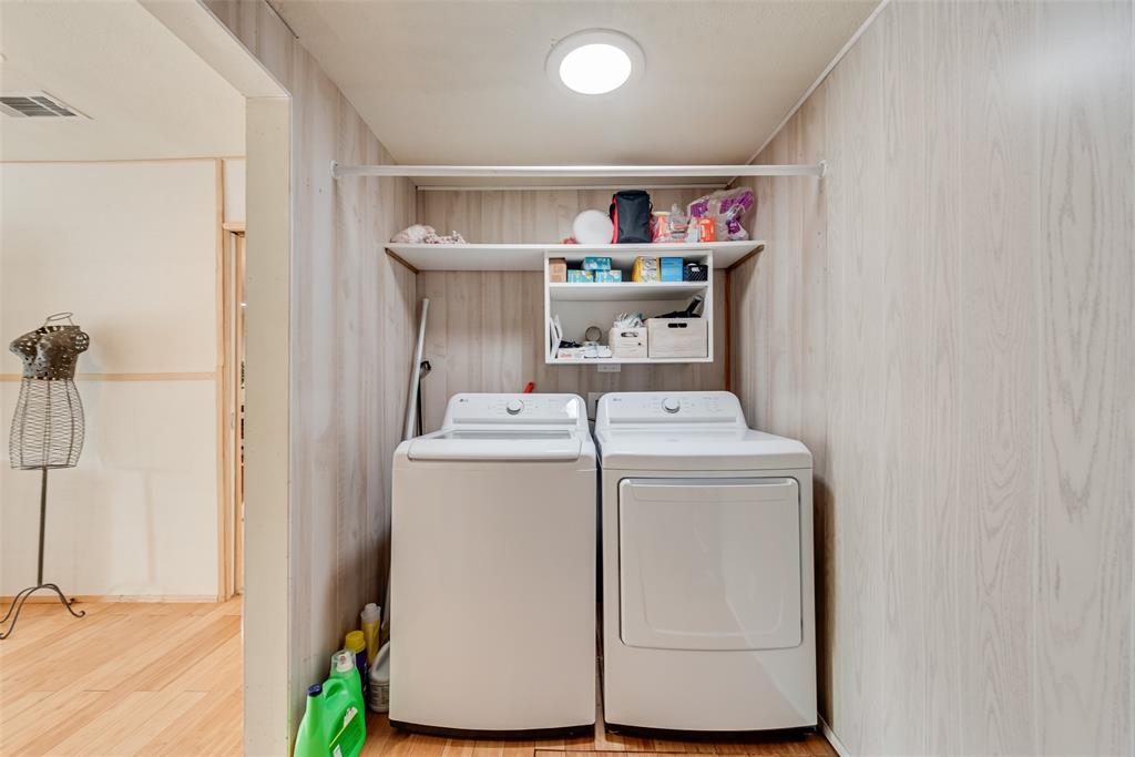 10605 Ferguson Road Dallas, TX 75228 - Photo 18 of 27 a utility room with dryer and washer