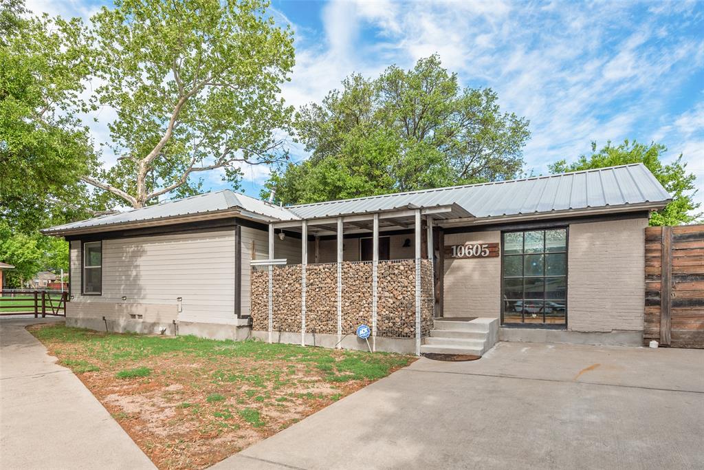 10605 Ferguson Road Dallas, TX 75228 - Photo 2 of 27 a front view of a house with garden