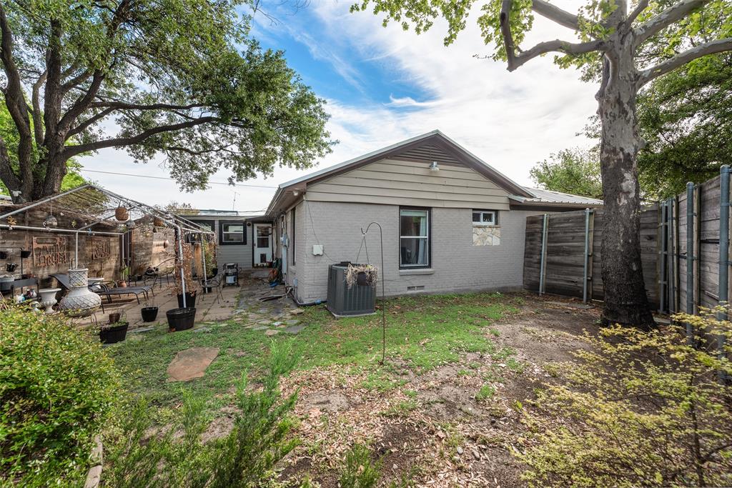 10605 Ferguson Road Dallas, TX 75228 - Photo 22 of 27 a view of a house with a yard