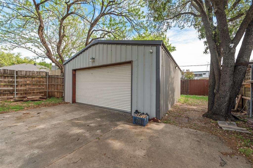 10605 Ferguson Road Dallas, TX 75228 - Photo 23 of 27 a house with trees in front of it