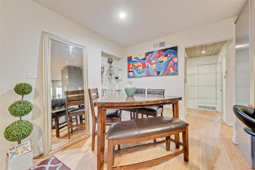 10605 Ferguson Road Dallas, TX 75228 - Photo 7 of 27 a dining room with furniture and wooden floor