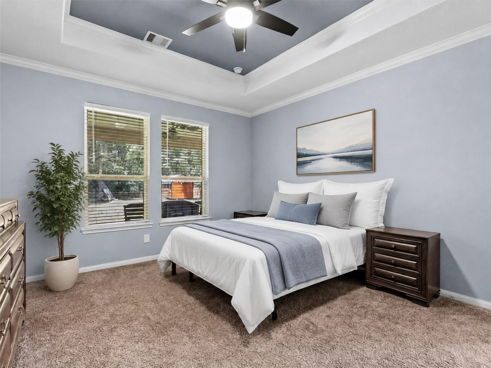 28619 Riverside Crest Lane Huffman, TX 77336 - Photo 18 of 48 Retreat to the spacious first-floor primary suite featuring a tray ceiling, fresh paint and peaceful natural light.