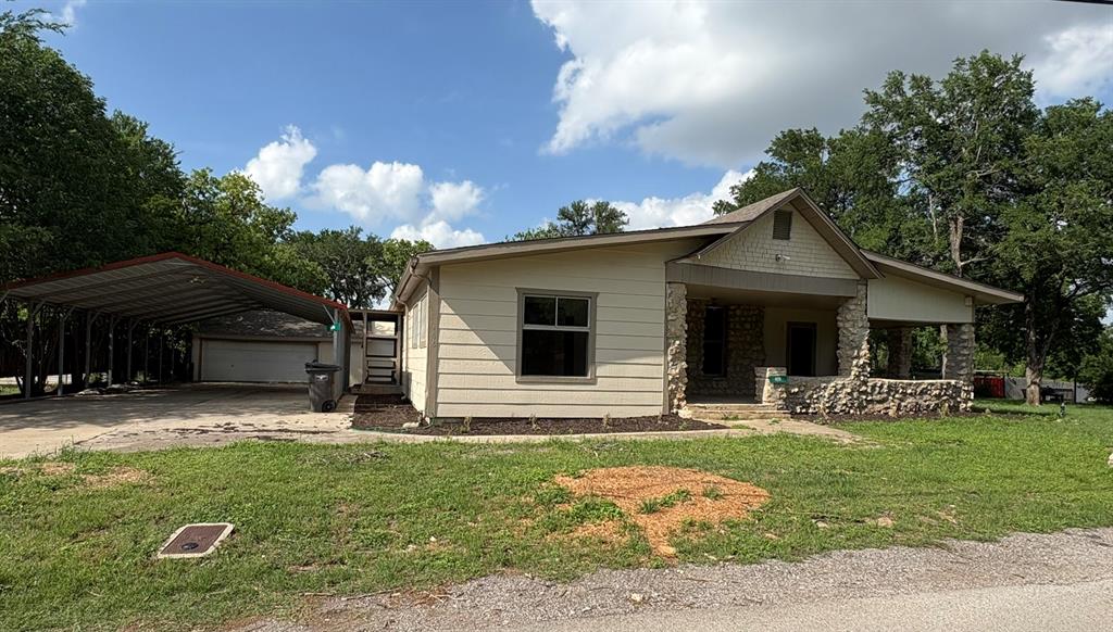 4876 East Williams Spring Road Fort Worth, TX 76135 - Photo 1 of 20 a front view of house with yard and green space