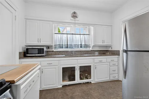 $999,000 | 114 New Hyde Park Road, Garden City, NY 11530
