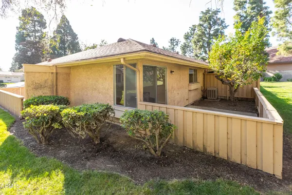 a front view of house with yard and seating space