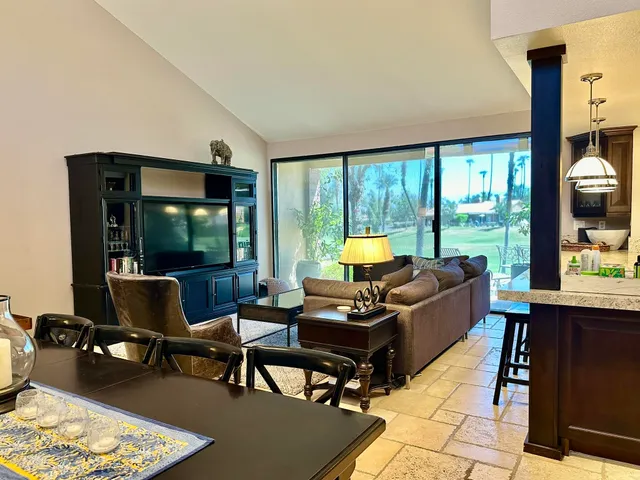 a kitchen with a refrigerator sink and cabinets