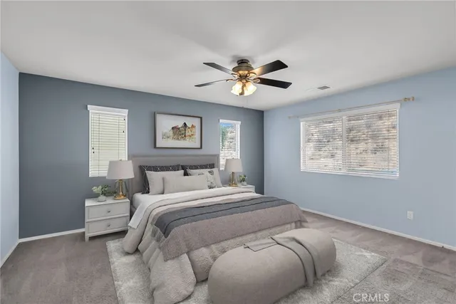 a bedroom with a large bed and a window