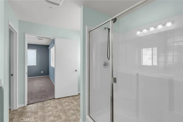 a view of a bathroom with a shower and a sink