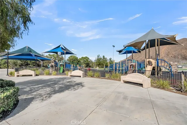 a view of a street with sitting area