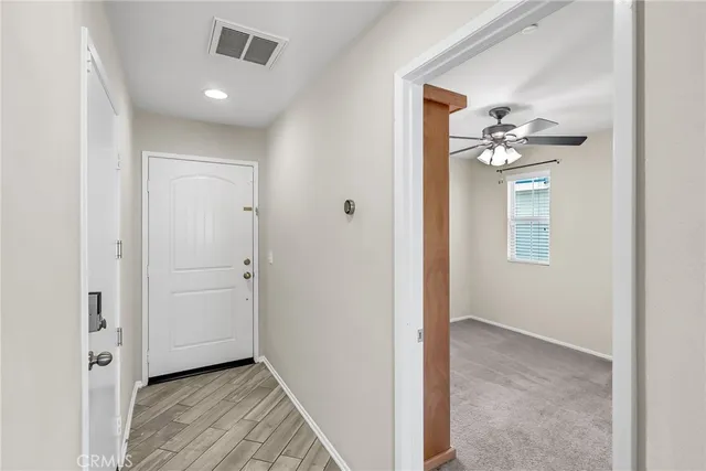 a view of a bathroom from the hallway