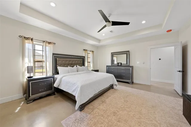 a bathroom with a shower a mirror and a sink