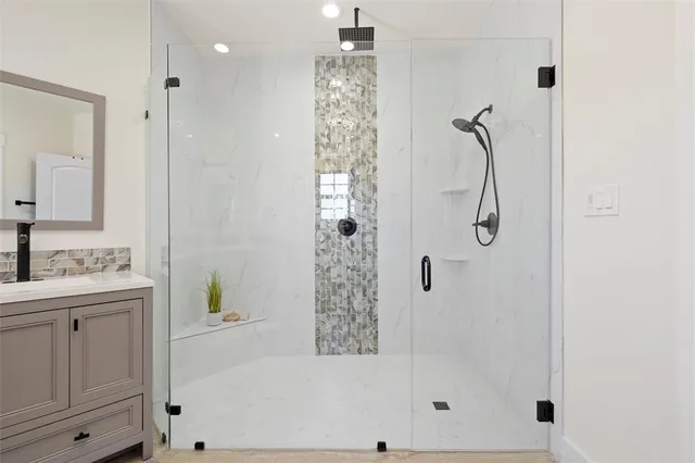 a spacious bathroom with a double vanity sink a toilet and a window