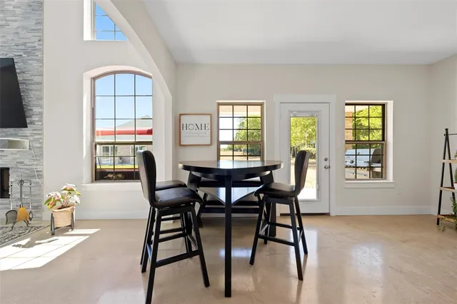 a kitchen with sink a window and cabinets