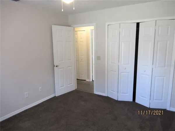 an empty room with closet area